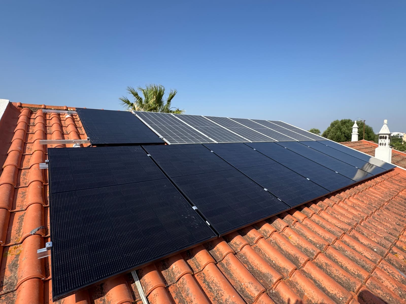 Solar panels installed on a tiled roof in the Algarve